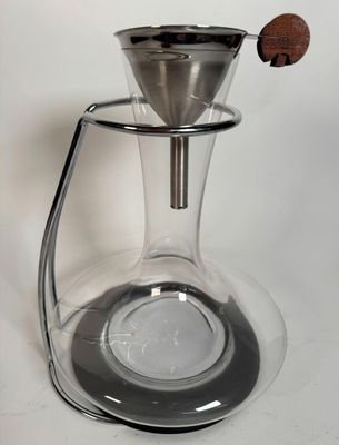 an image of a glass coffee pot with a wooden handle