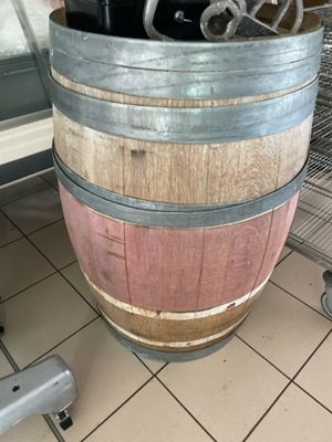a wine barrel that is sitting on the floor