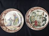 two brown and white plates with pictures of people and animals on them