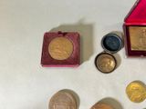 a small red box with some gold coins and a small red box with some gold coins