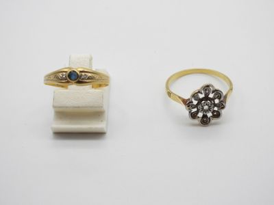 two gold rings and a diamond ring