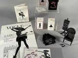an image of a collection of perfumes and cards on a table