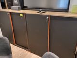 a flat screen tv sitting on top of a entertainment center