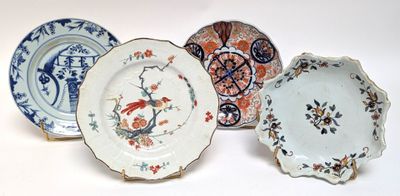 three plates with different designs on them sitting on a white surface