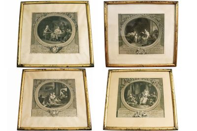 four framed pictures of a family in a living room