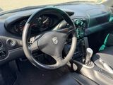 dashboard of a car with a steering wheel and dashboard controls