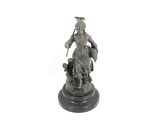 a statue of a man riding a horse on a pedestal