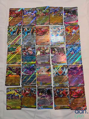 a pile of pokemon cards sitting on top of a table