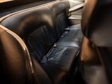 a black leather seat in the back of a car