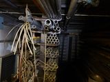 a bunch of pipes that are hanging from the ceiling