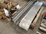 a pile of pallets and boxes in a warehouse