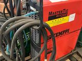 a red machine that is sitting on a pallet