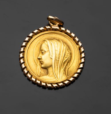 l'image d'une pièce d'or sur laquelle figure le visage d'une femme