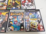 several video games are lined up on a white table