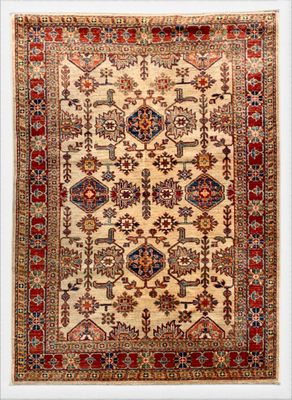 an antique persian rug with a white background and a red border