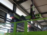 a crane that is sitting on top of a green machine