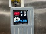 a control panel on the side of a stainless steel refrigerator