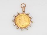 an image of a gold coin with pearls hanging from it ' s side