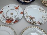 four plates that are sitting on a table