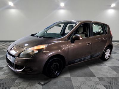 a picture of a small car parked in a garage