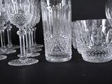 a lot of wine glasses that are sitting on a table