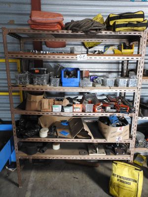 a shelf with many items on it in a garage