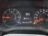 a close up of a car dashboard with a speedometer and gauges