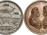 four different types of coins are shown on a white background