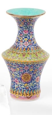 two vases sitting next to each other on a table