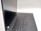 a laptop computer sitting on a table with a keyboard