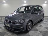 the volkswagen touran is parked in a large room with a checkered floor