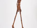 an image of a sculpture of a man holding a baseball bat