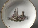 a plate that has a picture of a castle on it