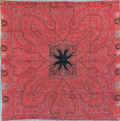 a red and black paisley design on a red background