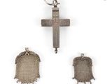 a close up of a cross and a chain mail bag