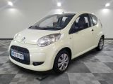 a picture of a small white car on a checkered floor