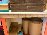 a shelf with a lot of boxes and a bag on it