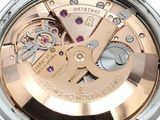 a close up of a wrist watch with a rose gold dial