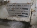 a sign on the side of a machine that is dirty