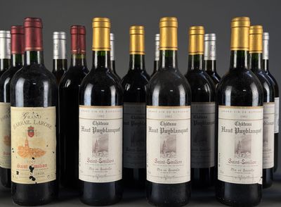 several bottles of wine are lined up on a table