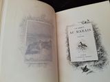 un livre ouvert avec l'image d'un oiseau dessus