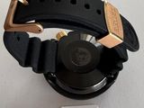 a close up of a wrist watch with a tag attached to it