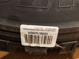 a close up of a tire with a barcode on it