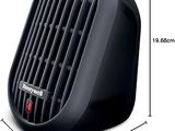 un radiateur noir posé sur une surface blanche