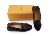 a close up of a pair of shoes with a box in the background