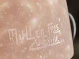 a close up of a bottle of liquid with a sticker on it