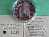 a picture of a piece of paper with a coin on it