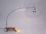 a lamp that is sitting on a table with a bench