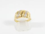 a yellow gold ring with diamonds on a white background