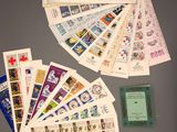 a lot of stamps and a book on the table